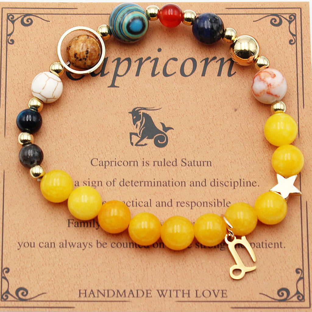 Capricorn zodiac beaded bracelet with yellow beads, multicolor accents, and goat charm