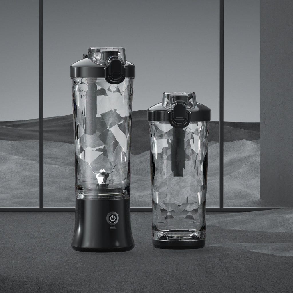 Portable blender with clear blending bottles and black base, shown with second cup