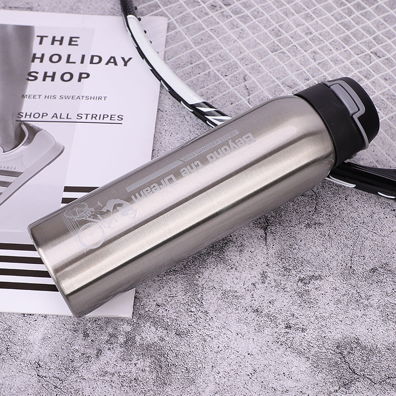 Bike water bottle in silver with black flip cap