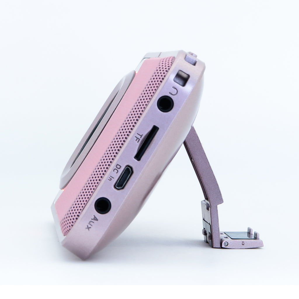Mini portable Bluetooth speaker, pink side panel with ports and control buttons