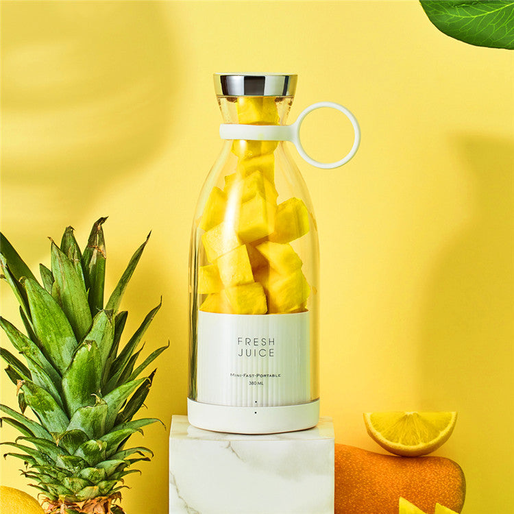 Clear yellow portable electric juicer blender bottle with silver top and handle