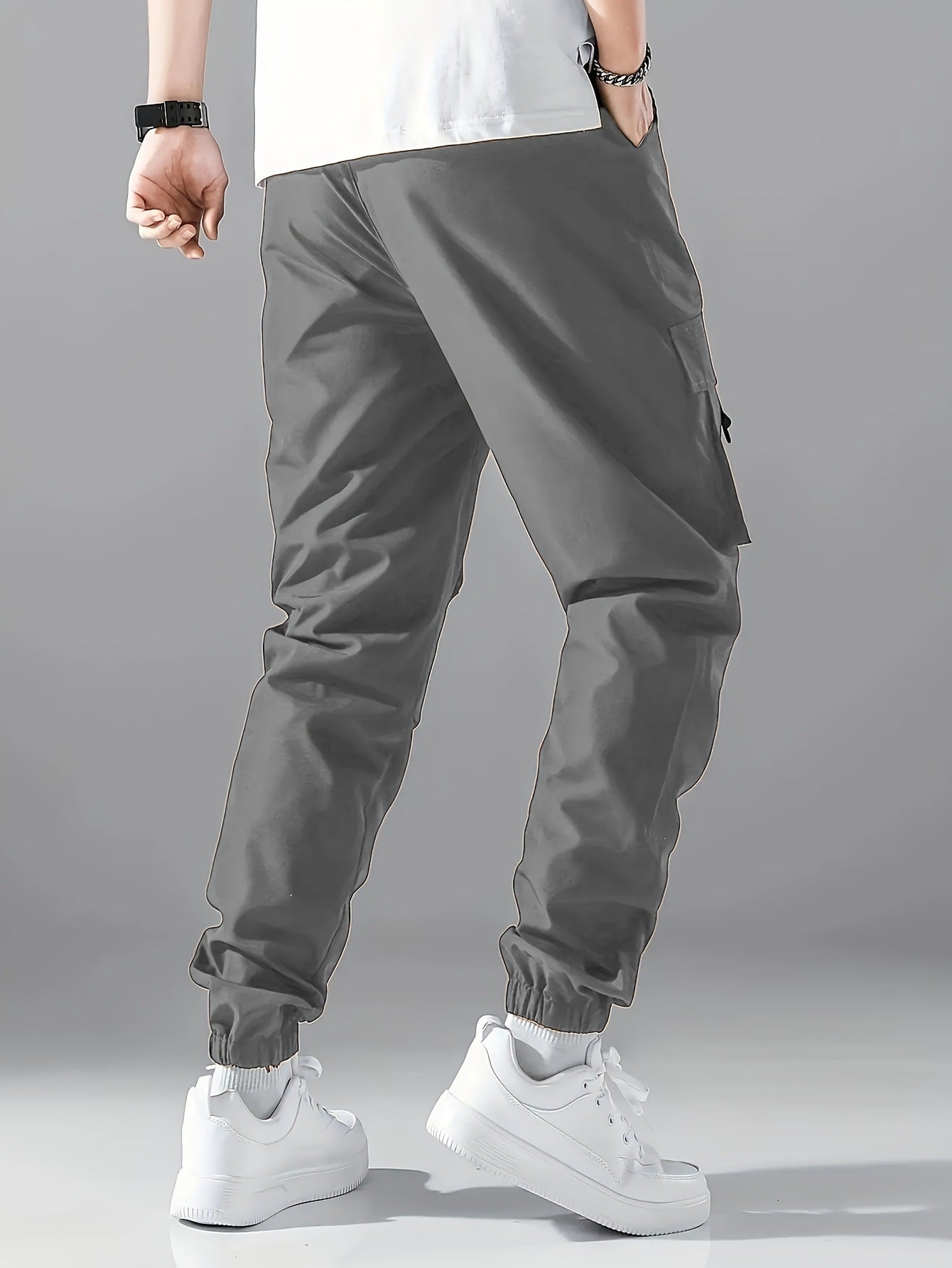 Gray cargo jogger pants with side utility pockets and cuffed ankles
