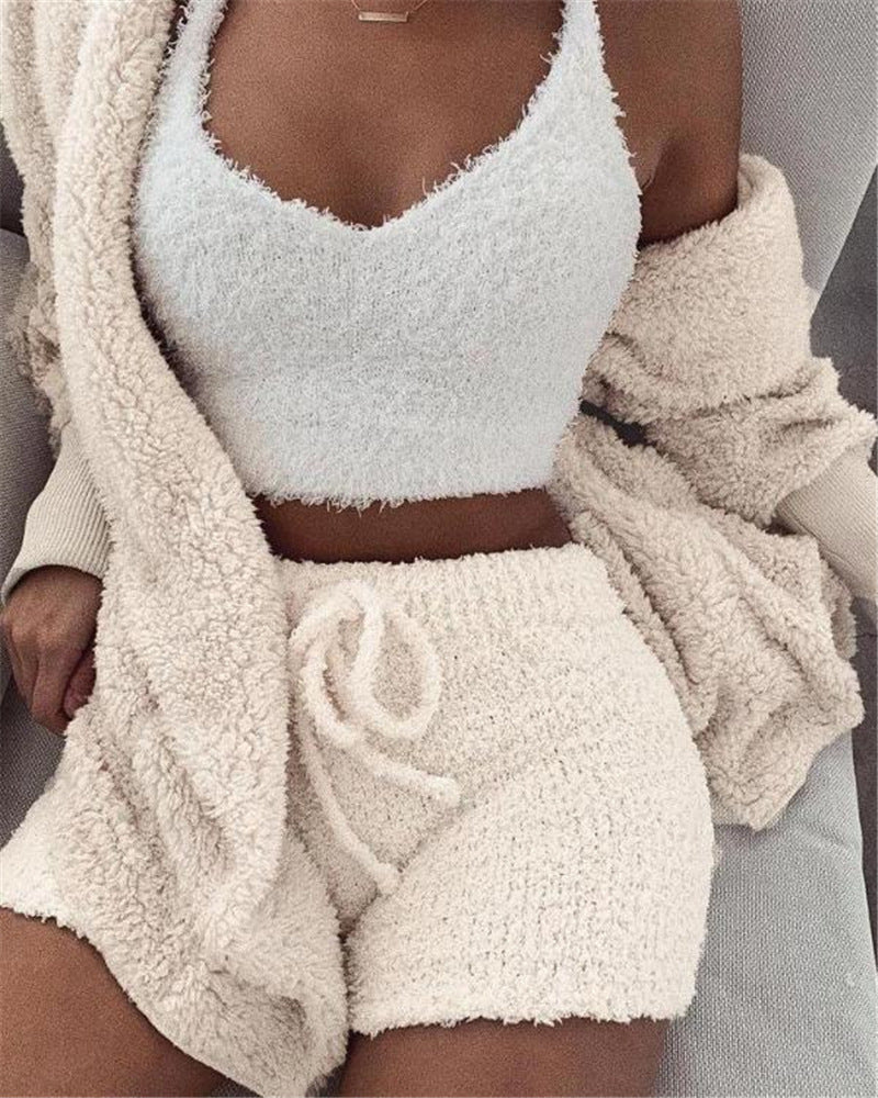 White fuzzy pajama set: cropped tank top with drawstring shorts and long-sleeve cardigan