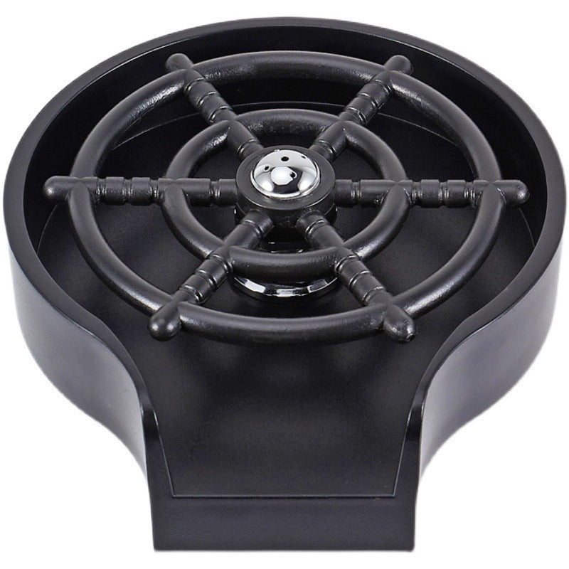 Cup washer sprayer head with black nozzle wheel and central water outlet, close-up