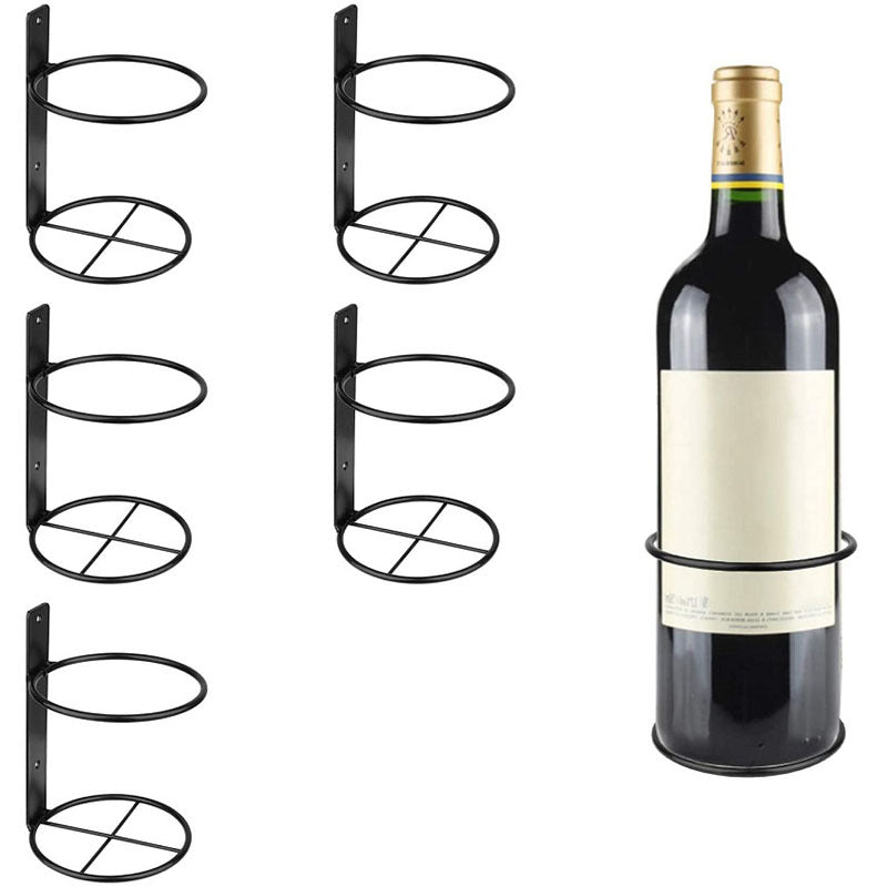 Black wall-mounted wine rack set with four oval holders holding one wine bottle