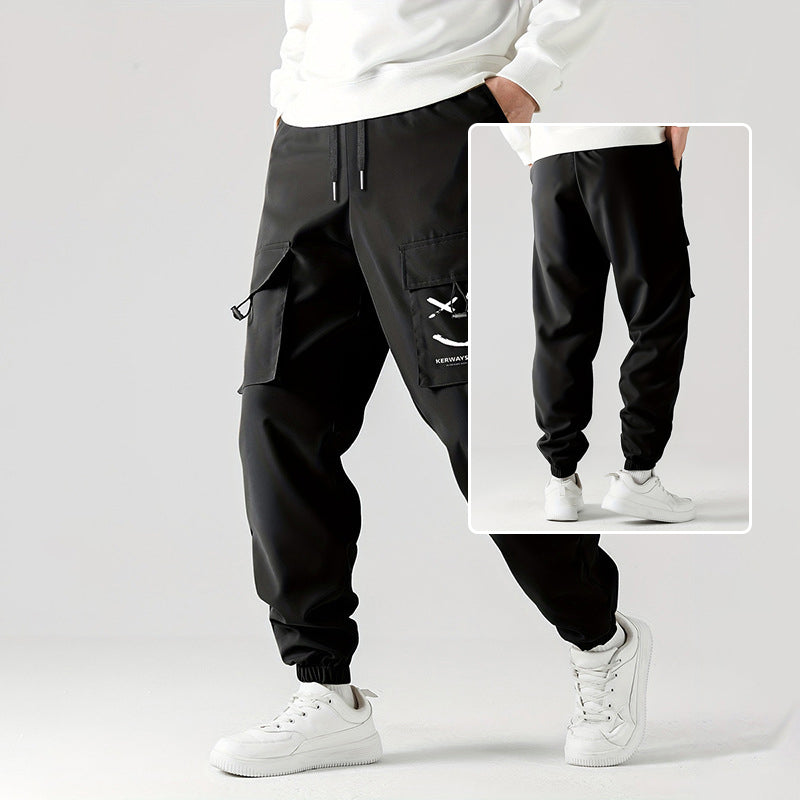 Black straight ankle cargo jogger pants with tied drawstring and cuffed hems