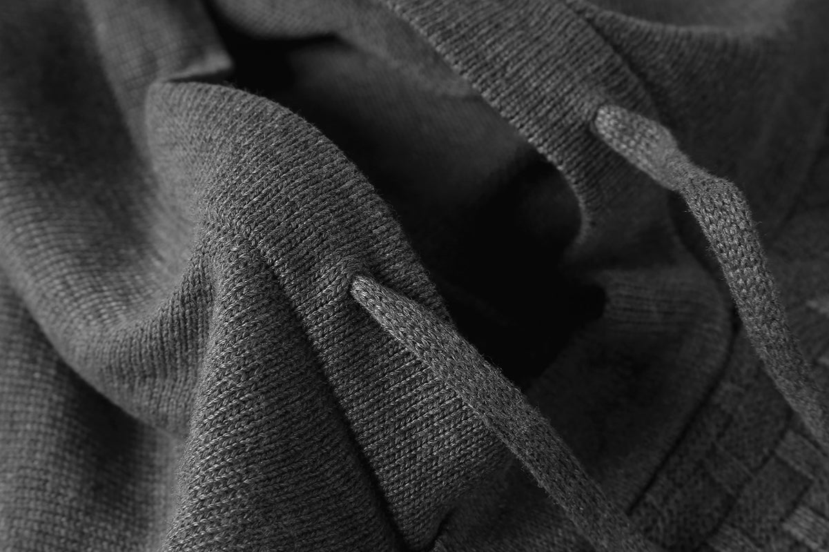 Men's hoodie sweater, gray textured knit fabric, close-up of ribbed cuff and sleeve