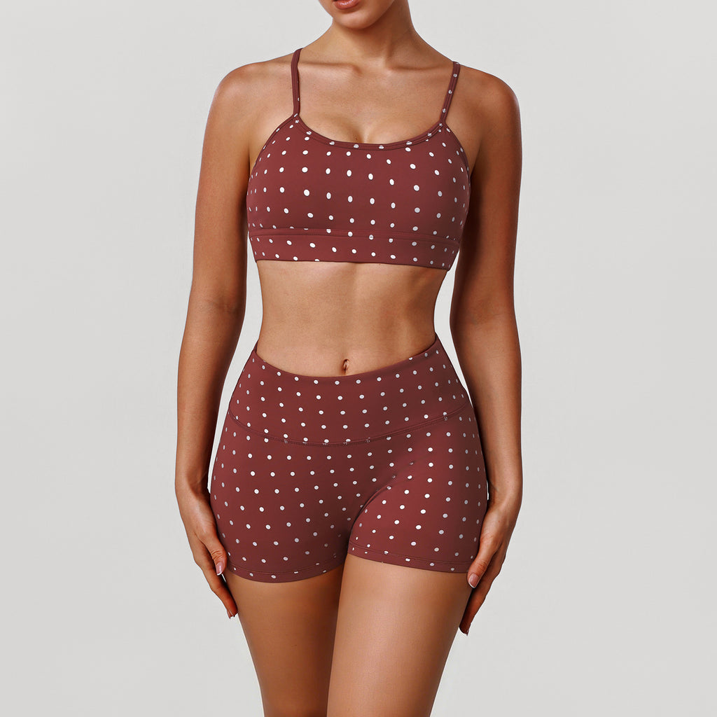 Women’s rust red sports bra and shorts set with white dot print, scoop neckline