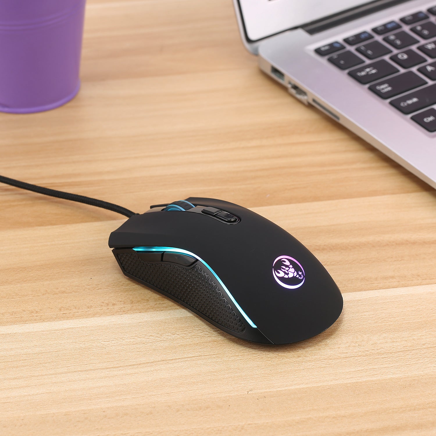 Black wired gaming mouse with multicolor RGB light strip and textured grip sides