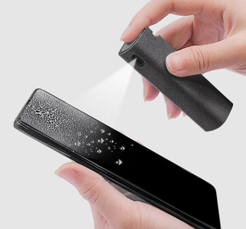 Screen cleaner spray bottle, black fabric body with nozzle, being used on a phone