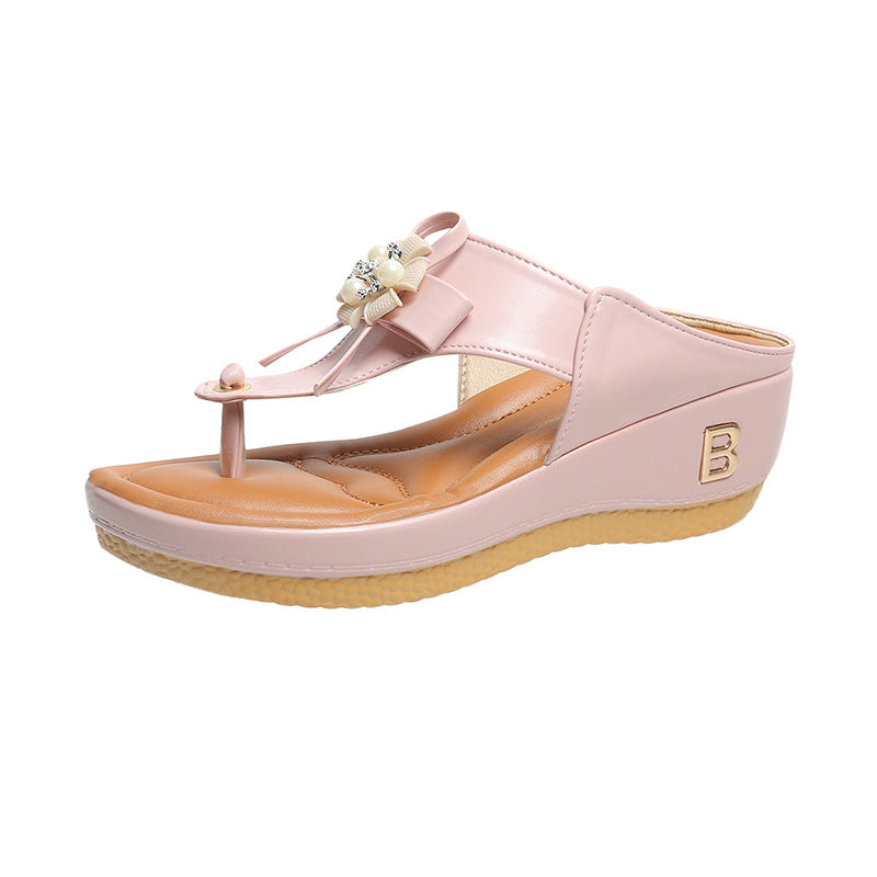 Women’s flower wedge platform flip flops in pale pink with flower bow detail and toe ring