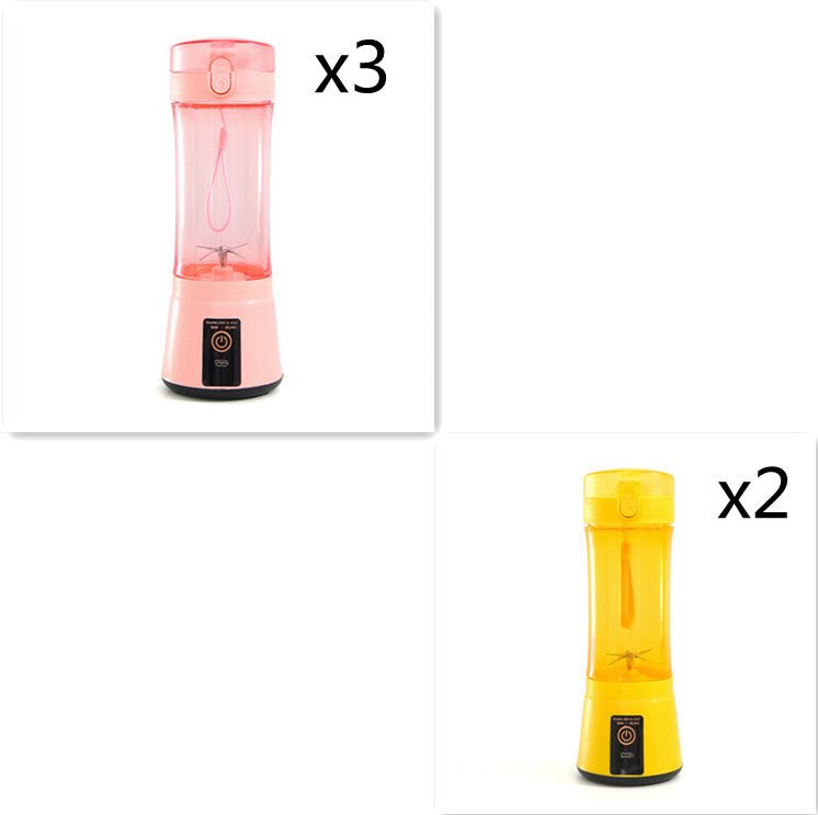 Portable electric fruit juicer with pink blender cup and yellow blender cup