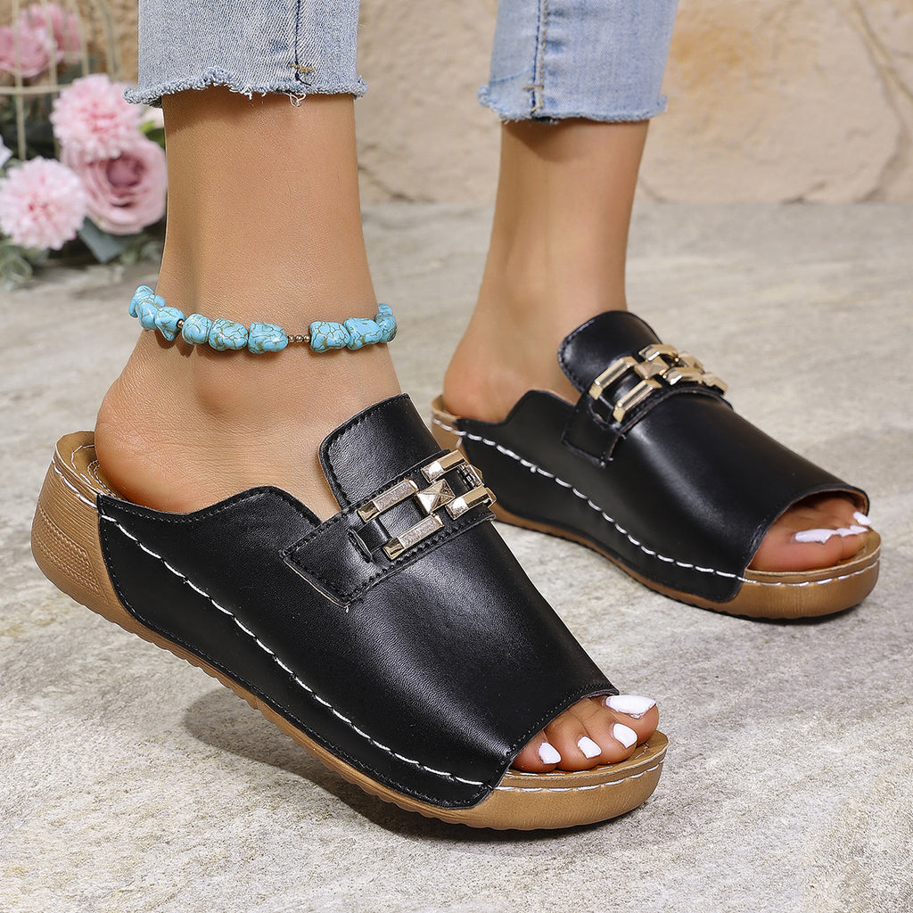 Black peep-toe wedge slippers with gold metal buckle and blue beaded ankle strap