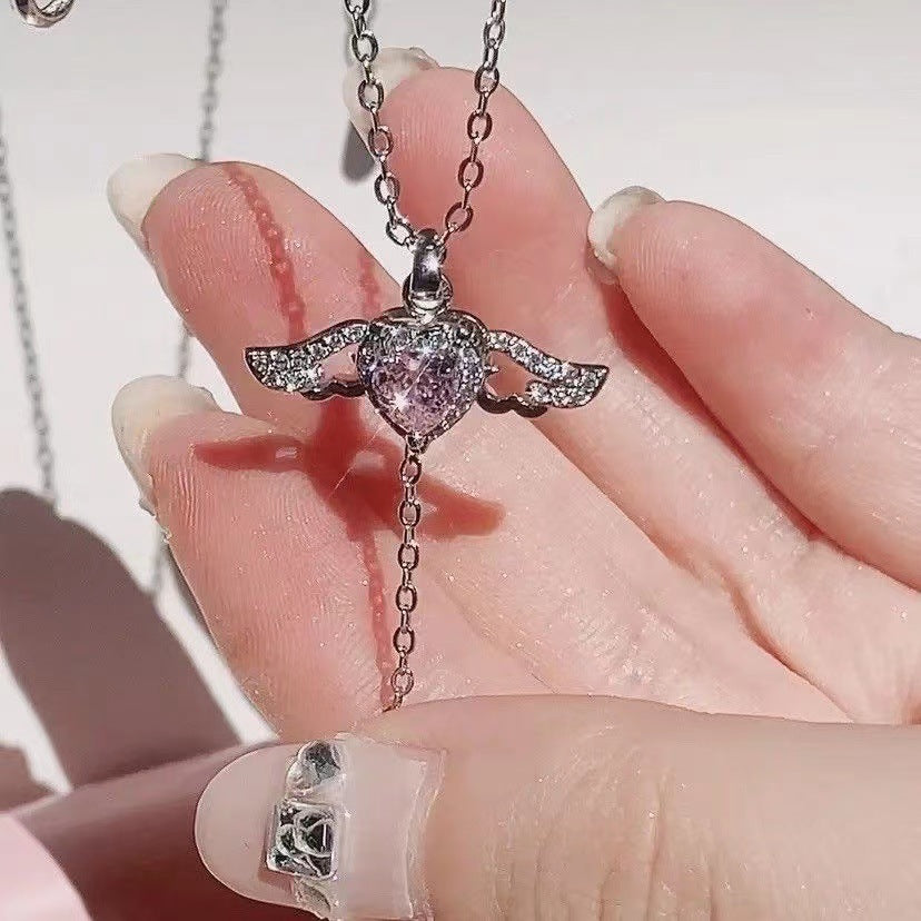 Crystal angel wing heart necklace centerpiece with small wing charms on silver chain
