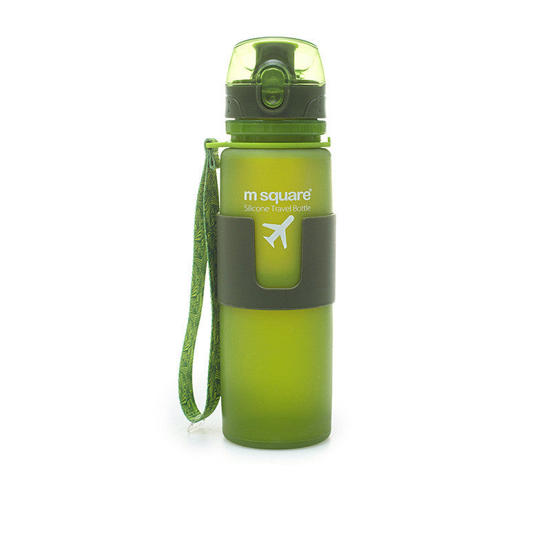 Green silicone travel water bottle with carry strap, shown from the side