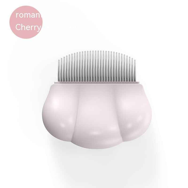 Pink cherry-toned pet grooming comb with metal teeth in shell grip
