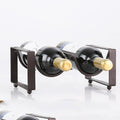 Black wine bottle rack with two curved holders and two displayed bottles